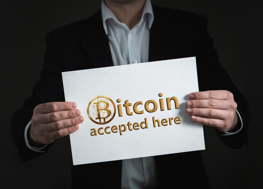 How to Buy Digital Products Privately with Crypto - bitcoin, cryptocurrency, currency, crypto currency, money, cash, to buy, pay, accepted, permitted, leaf, paper, keep, nature, hand, finger, photomontage, composing, composition
